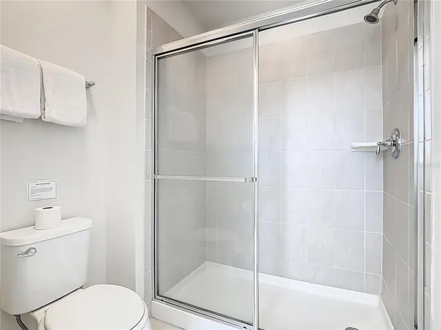 a bedroom with a bed and cupboard