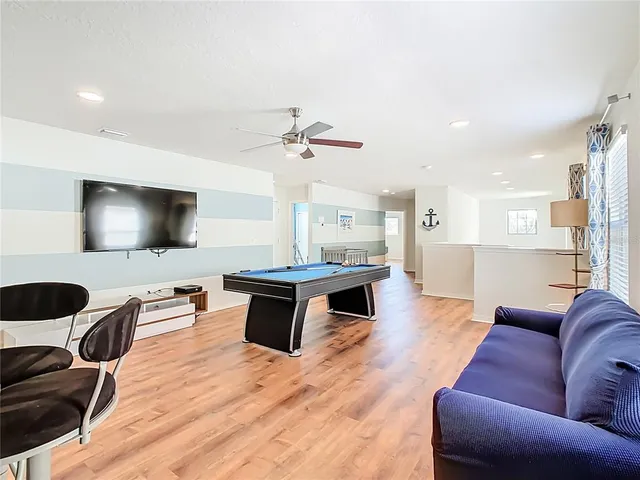 a bathroom with a granite countertop sink a toilet and a mirror