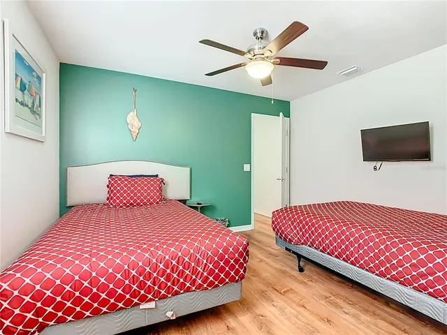 a bed sitting in a bedroom next to a window