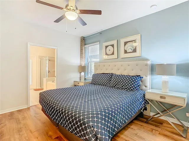a view of a dining room with furniture wooden floor and next to a window