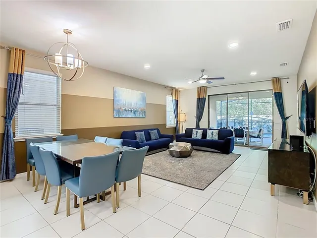 a bathroom with a granite countertop sink toilet and mirror