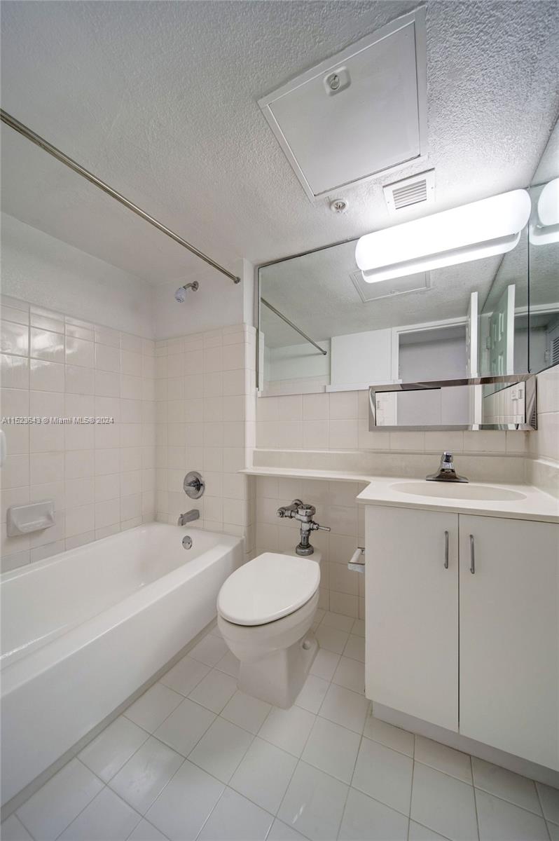 1500 Bay Road, Unit S0354 Miami Beach, FL 33139 - Photo 12 of 78 a bathroom with a sink a toilet and bathtub