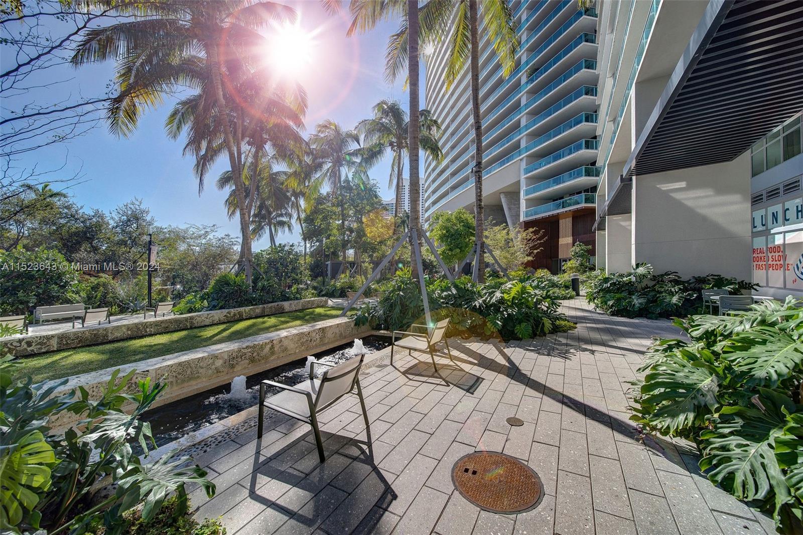 1500 Bay Road, Unit S0354 Miami Beach, FL 33139 - Photo 45 of 78 a view of a backyard with plants and a patio