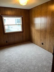 90 Willow Tree Drive Attleboro, MA 02703 - Photo 14 of 16 a view of an empty room with wooden floor and a window