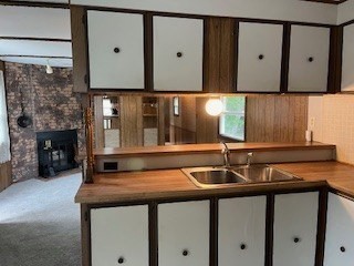 90 Willow Tree Drive Attleboro, MA 02703 - Photo 5 of 16 a kitchen with a sink and a mirror