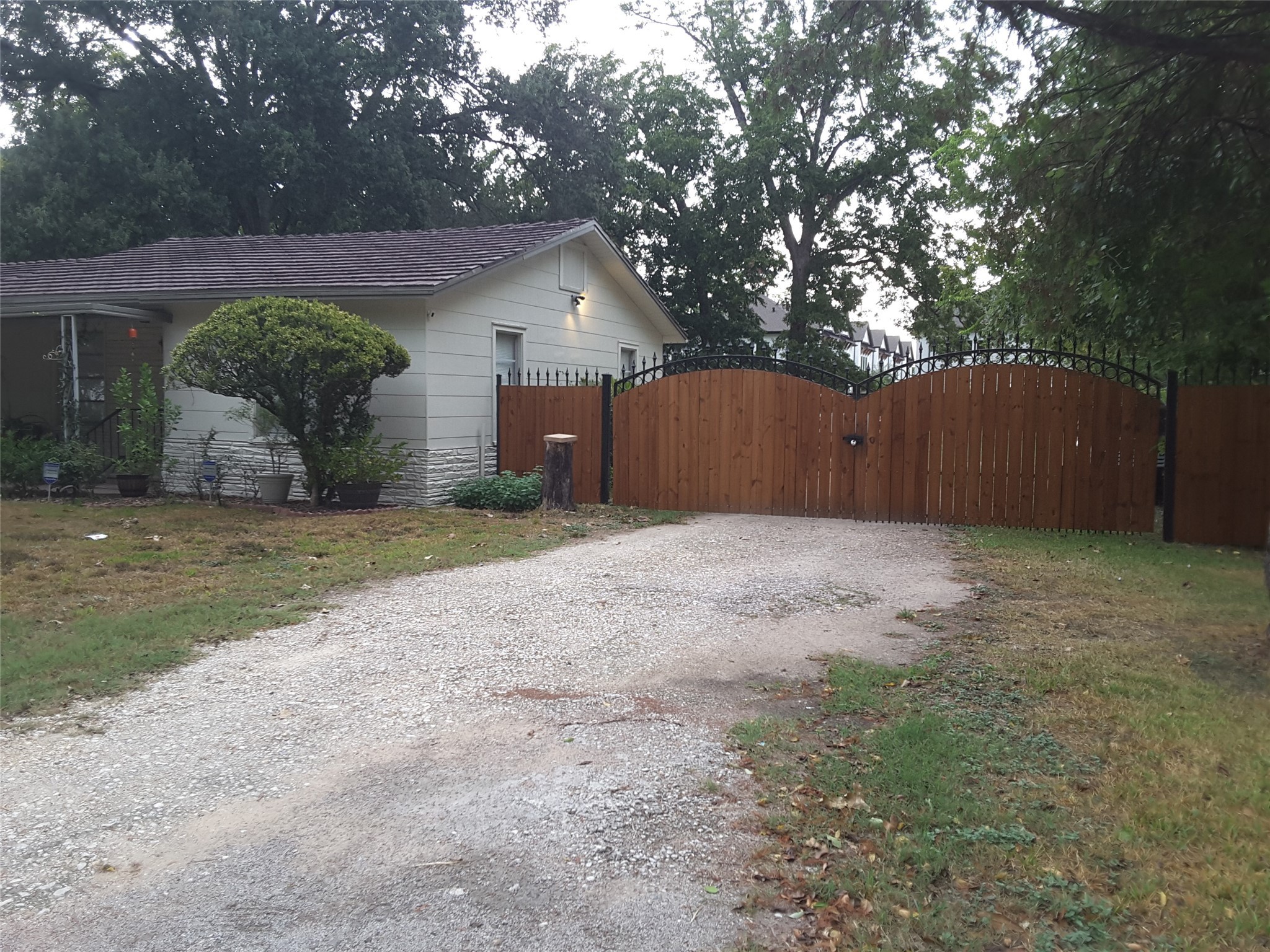 2132 Blalock Road Houston, TX 77080 - Photo 2 of 6 a view of a house with a small yard and wooden fence