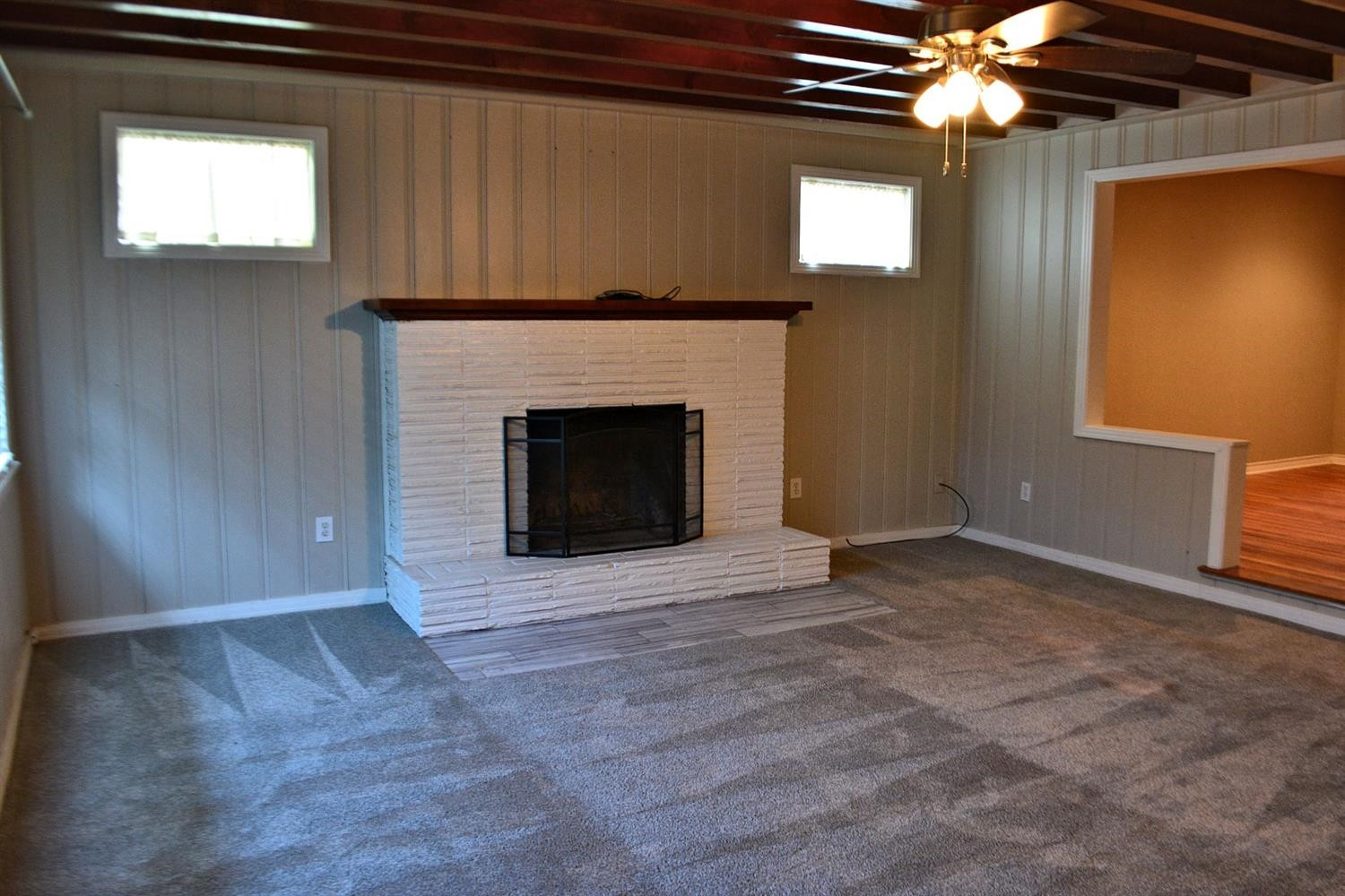 3213 26th Street Lubbock, TX 79410 - Photo 11 of 20 a view of an empty room with a fireplace
