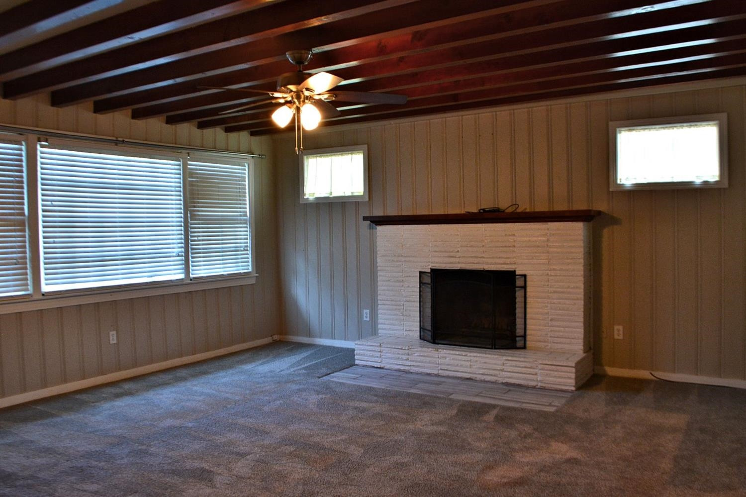 3213 26th Street Lubbock, TX 79410 - Photo 9 of 20 a view of a livingroom with a fireplace and window