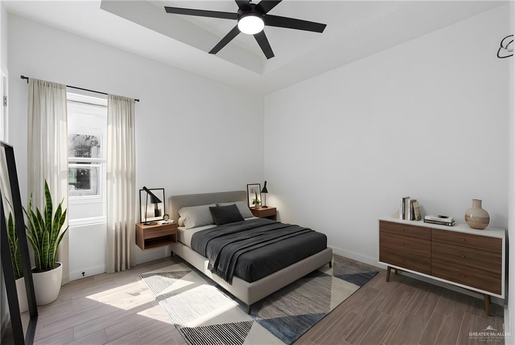 2902 Gabriel Street, Unit 1 Mission, TX 78574 - Photo 8 of 12 a bedroom with a bed and a potted plant