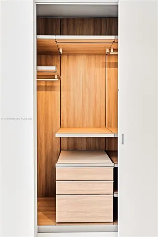 a bathroom with a toilet and a window