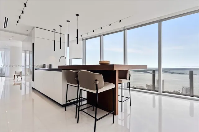 a view of a kitchen with kitchen island and a large window
