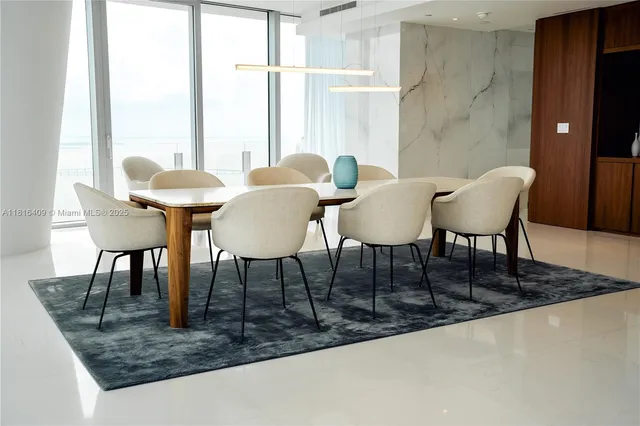 a view of a table and chairs in the balcony