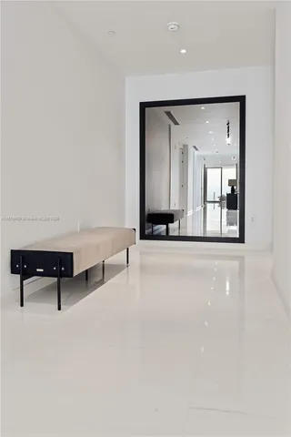 a view of an empty room with a fireplace