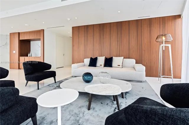 a living room with furniture and a lamp