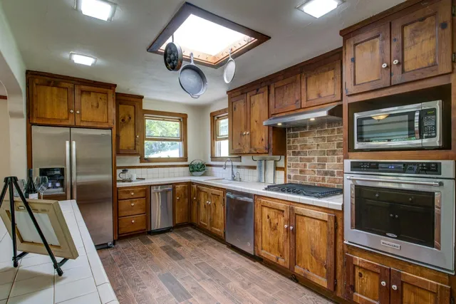 a bathroom with a sink a toilet and a bathtub