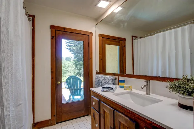 a view of a house with backyard porch and sitting area