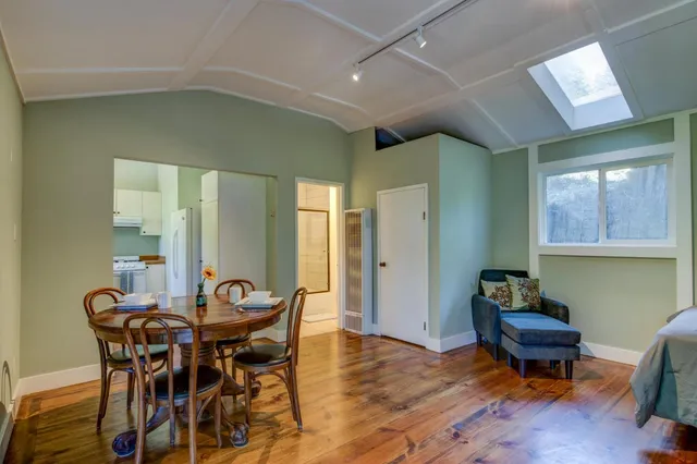 a view of a field with trees in the background