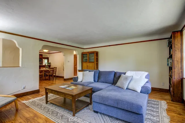 a living room with furniture and a rug