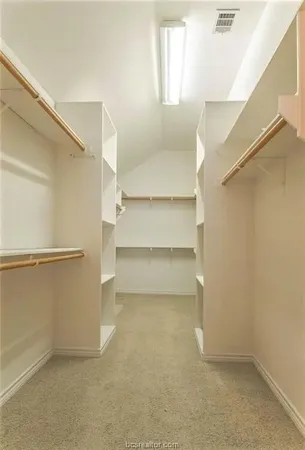 a view of an empty walk in closet