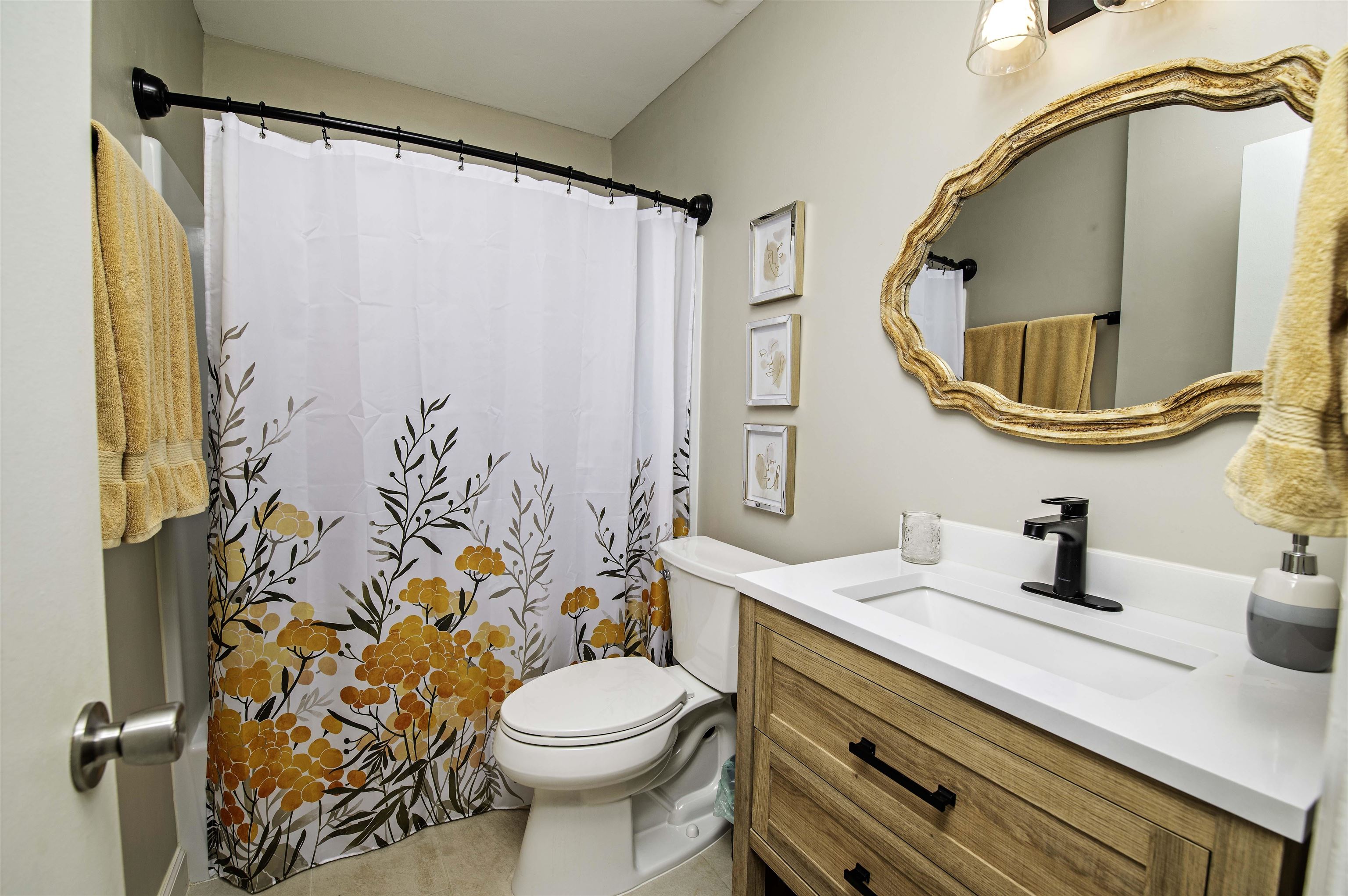 6452 Madison Street St. Augustine, FL 32080 - Photo 15 of 27 a bathroom with a sink and a mirror