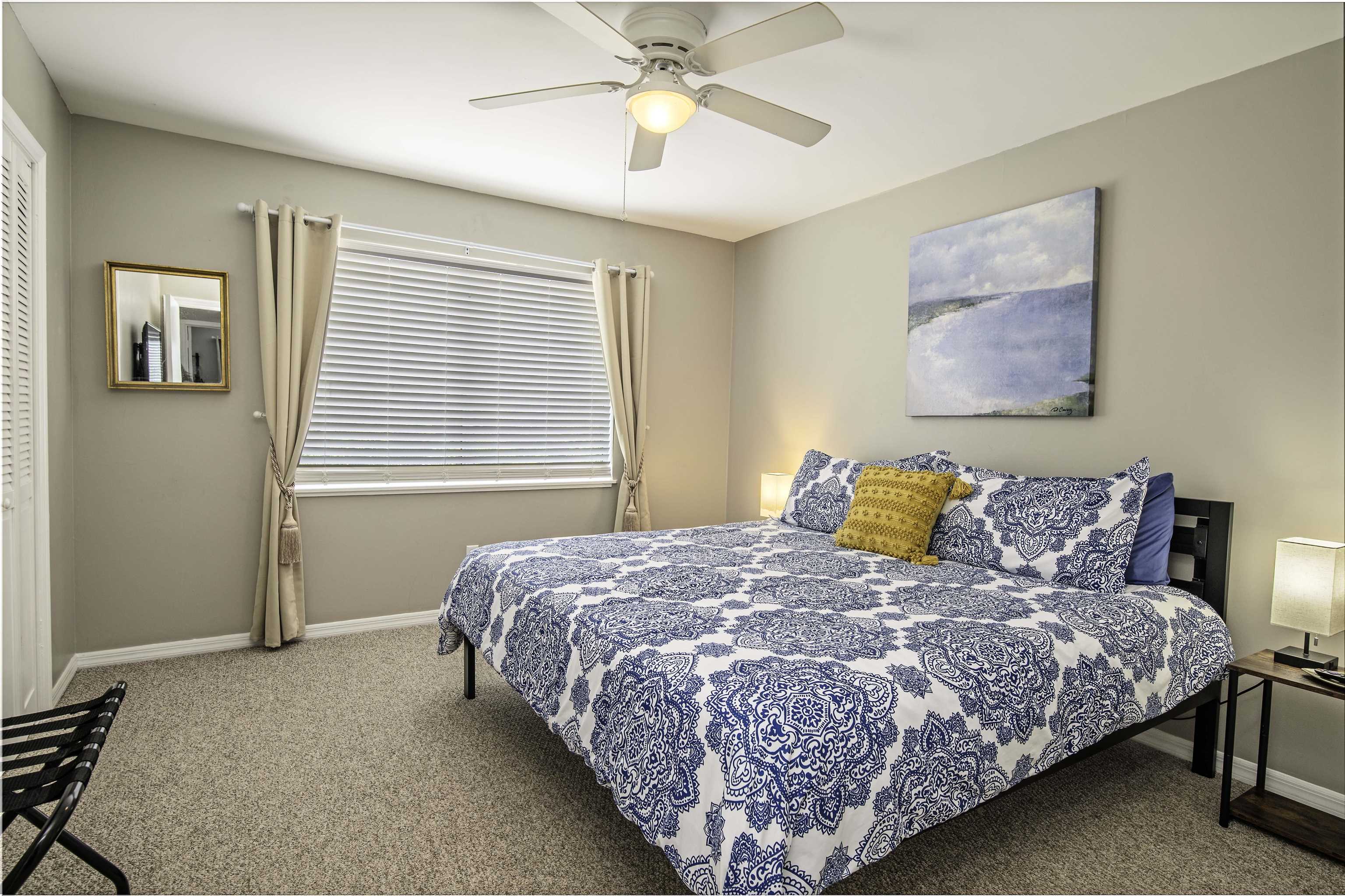 6452 Madison Street St. Augustine, FL 32080 - Photo 16 of 27 a bedroom with a bed and a chandelier