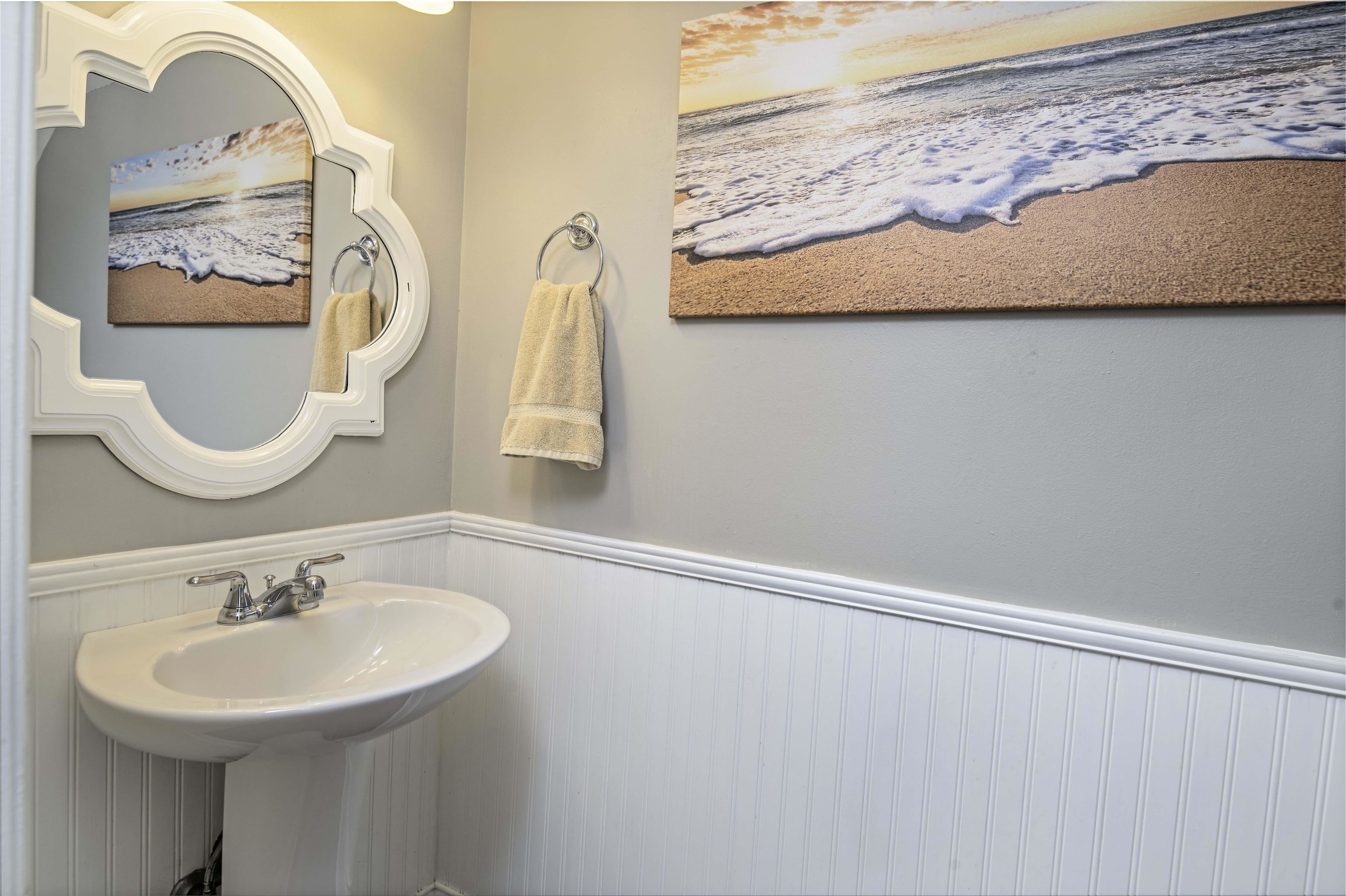 6452 Madison Street St. Augustine, FL 32080 - Photo 18 of 27 a bathroom with a sink and a mirror