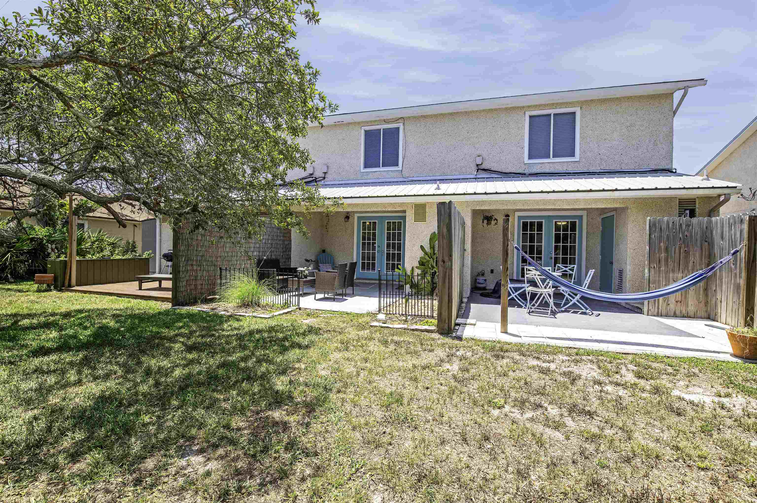 6452 Madison Street St. Augustine, FL 32080 - Photo 21 of 27 a house view with a sitting space and garden
