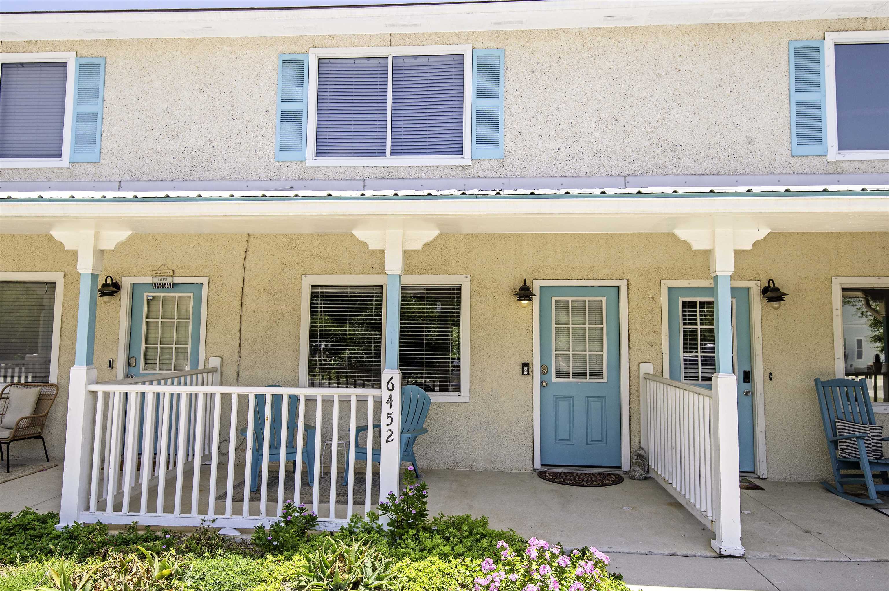 6452 Madison Street St. Augustine, FL 32080 - Photo 3 of 27 a view of a balcony with a floor to ceiling window and wooden floor