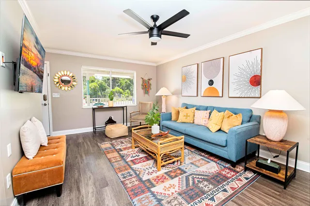 a living room with furniture and a large window