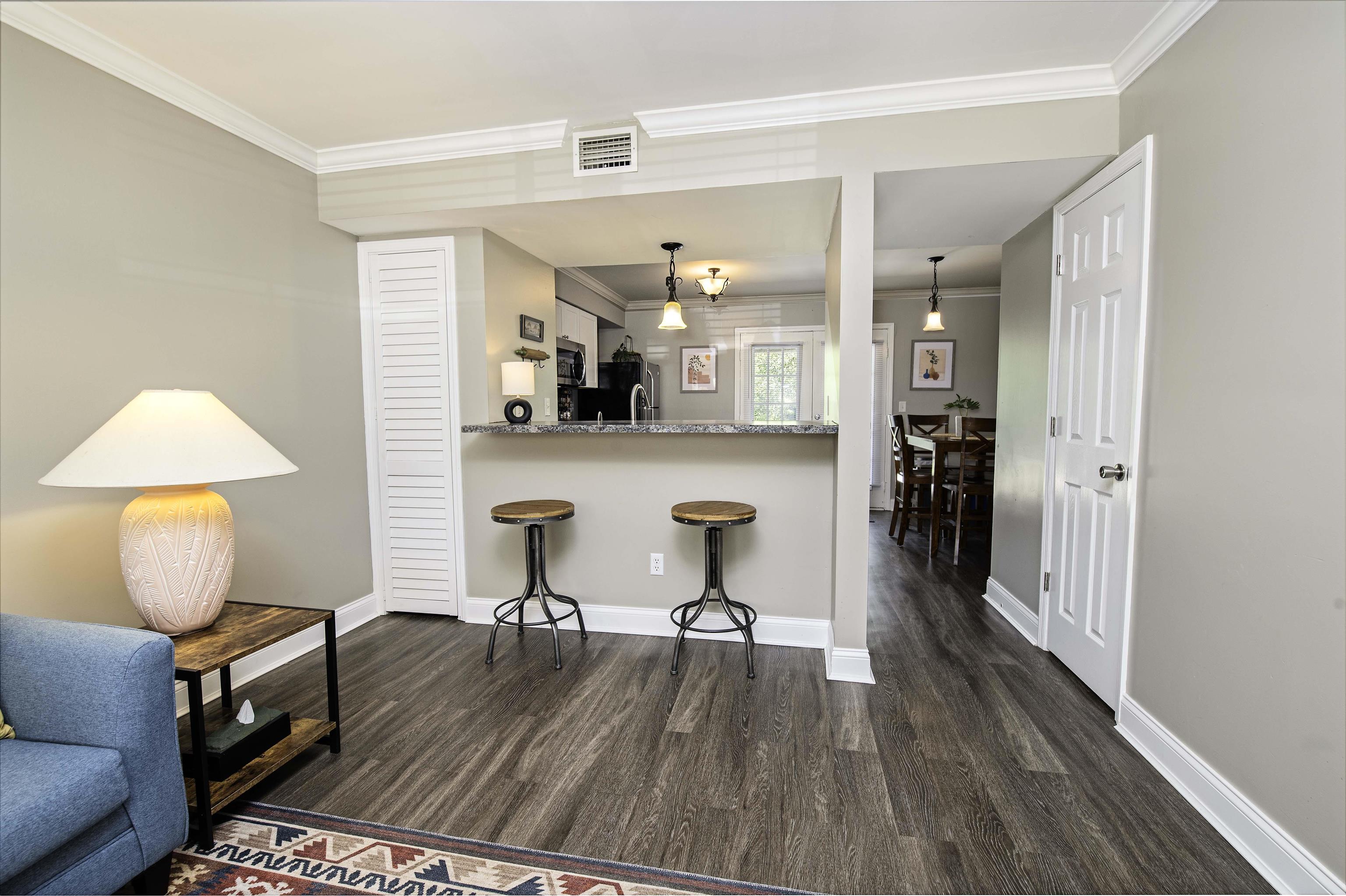 6452 Madison Street St. Augustine, FL 32080 - Photo 7 of 27 a view of a dining room with furniture and wooden floor