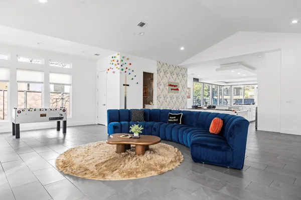 a living room with furniture and a table