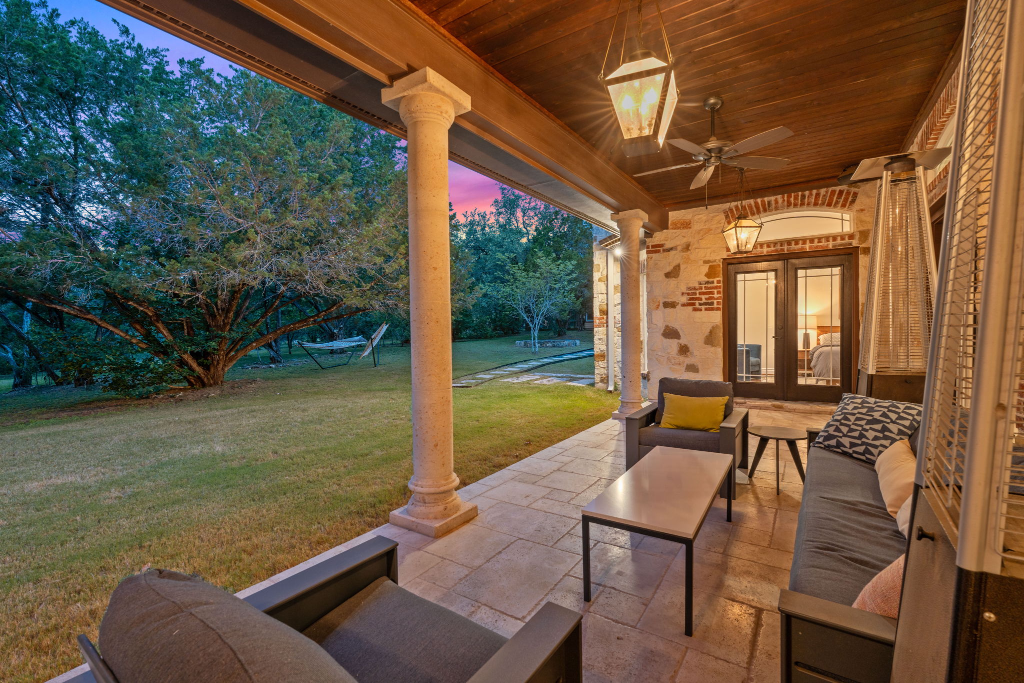 8121 Bluff Trail Austin, TX 78737 - Photo 30 of 40 An inviting stone patio offers comfortable outdoor living with scenic views of the lush yard.