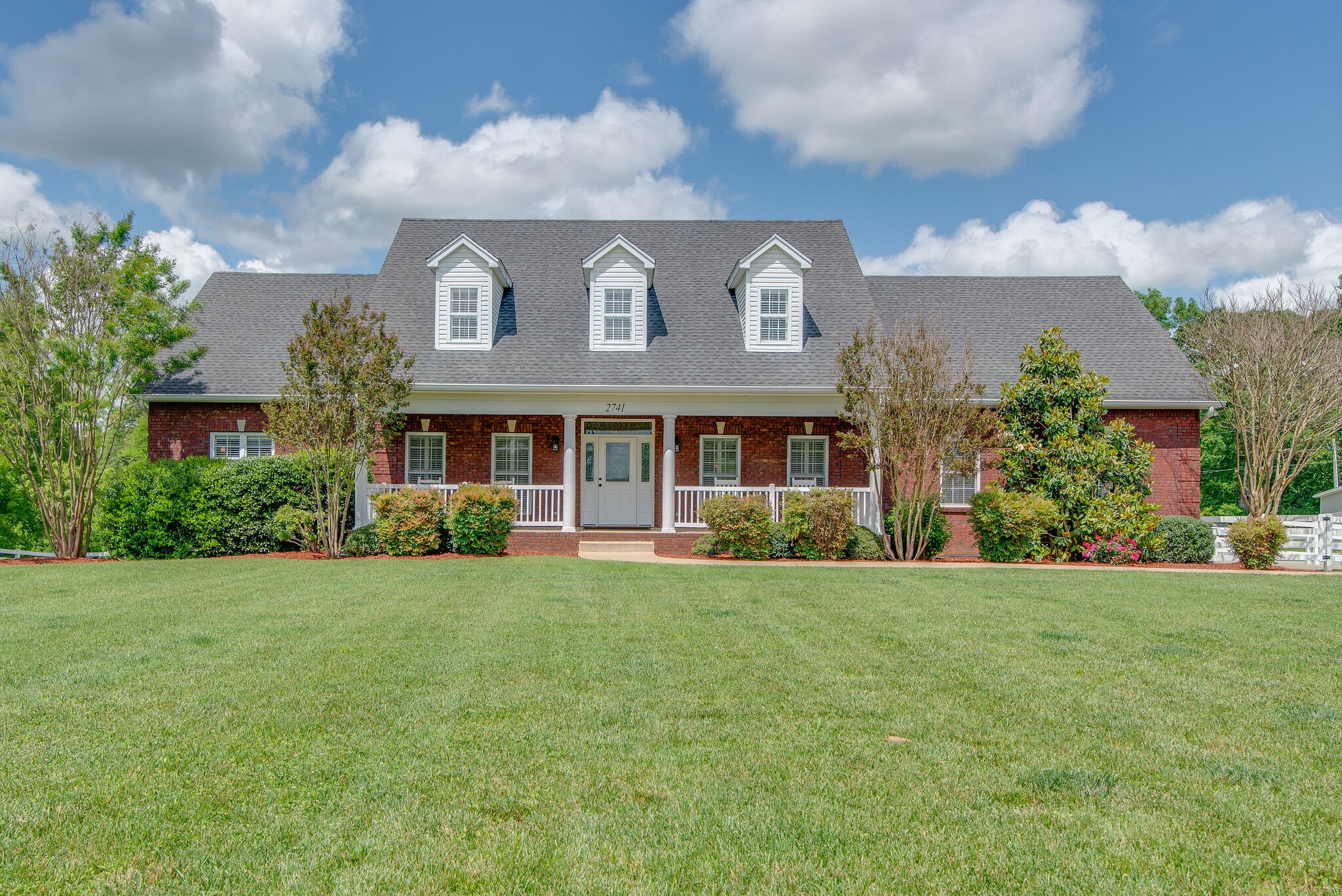 2741 Burgess Gower Road Springfield, TN 37172 - Photo 4 of 50 a view of a brick house with a yard