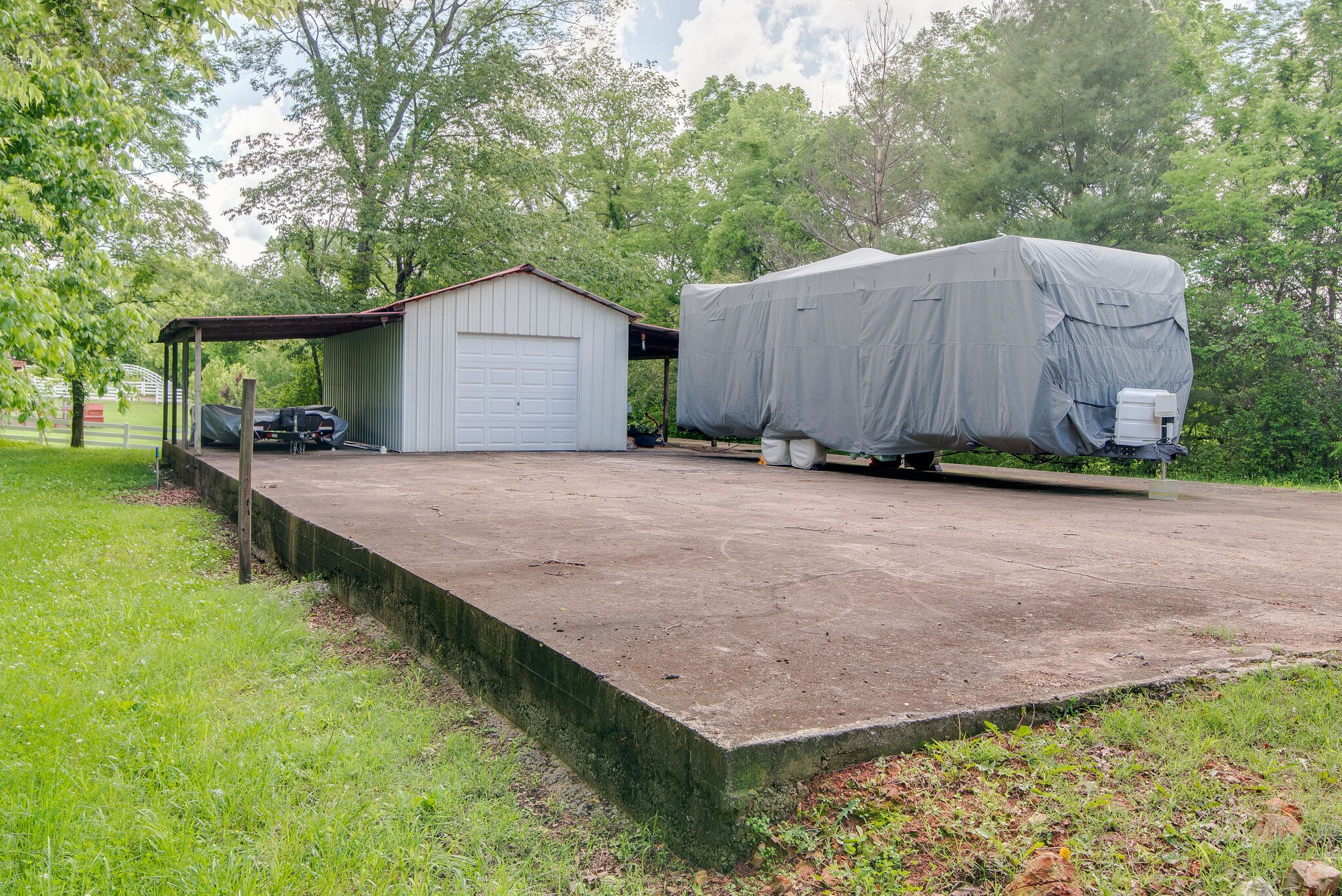 2741 Burgess Gower Road Springfield, TN 37172 - Photo 50 of 50 a backyard of a house with barbeque oven and outdoor seating