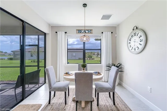 a view of a dining room with furniture window and outside view