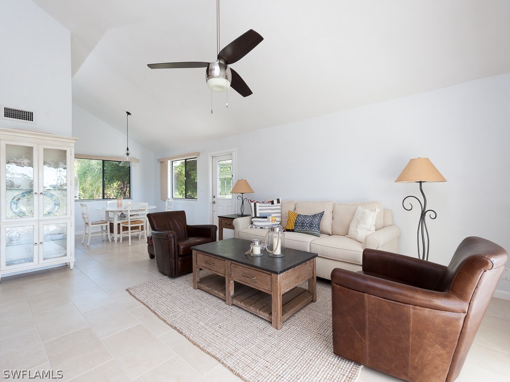 1631 Sand Castle Road Sanibel, FL 33957 - Photo 3 of 25 a living room with furniture and a large window