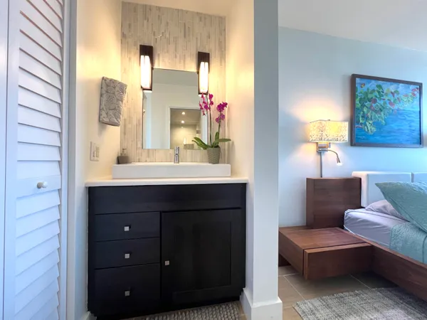 a bathroom with a sink and mirror