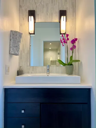 a bathroom with a toilet a sink and shower