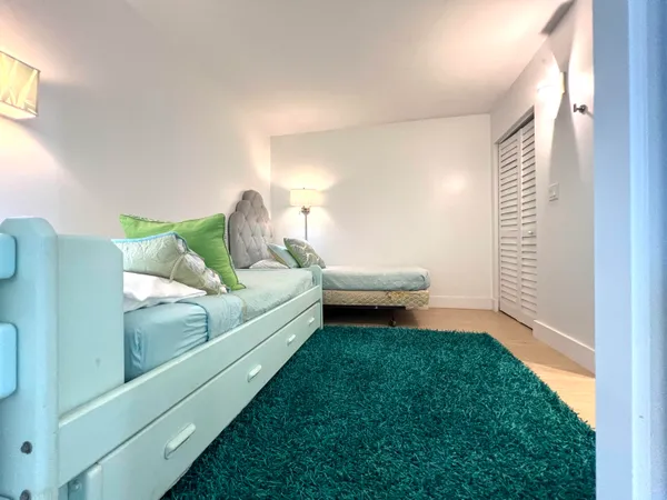 a view of a swimming pool with a table and chairs