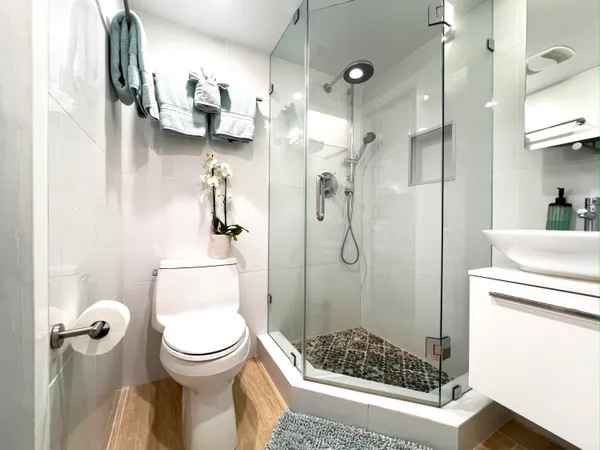 a living room with patio furniture and a floor to ceiling window