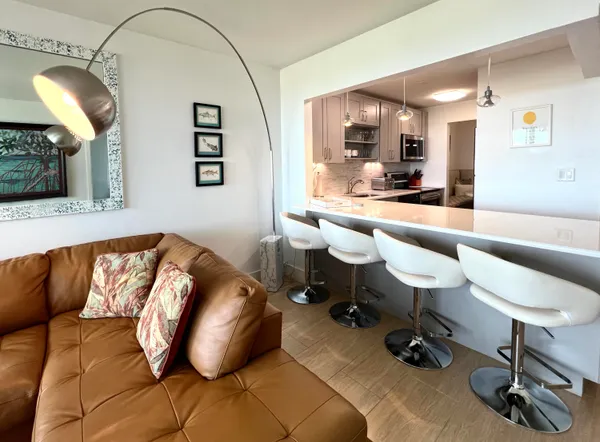 a kitchen with a sink stove and microwave
