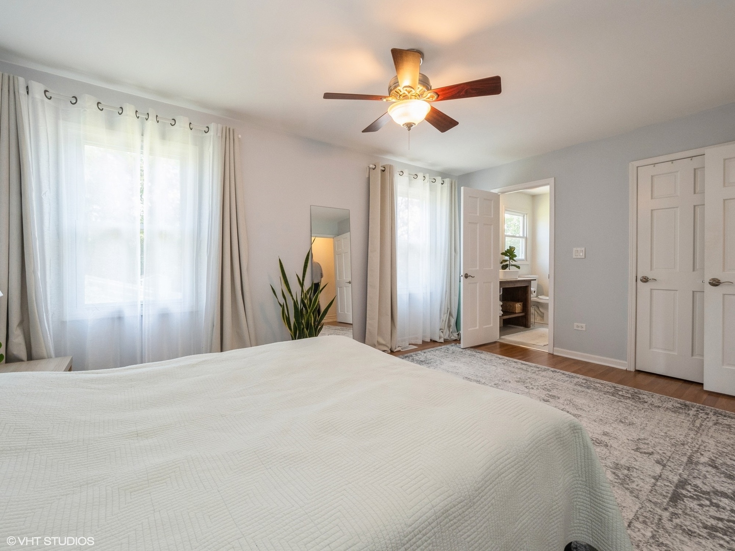 35 Crompton Court Fox River Grove, IL 60021 - Photo 16 of 39 a bedroom with a large bed and a chandelier