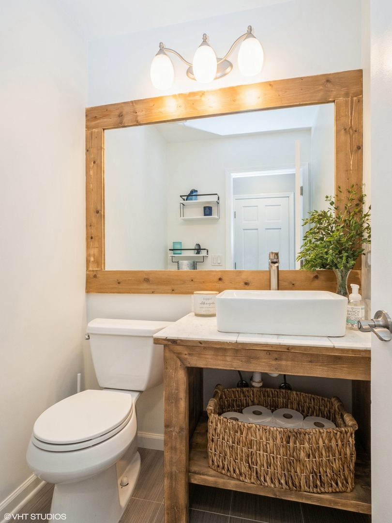 35 Crompton Court Fox River Grove, IL 60021 - Photo 5 of 39 a bathroom with a sink a toilet and mirror