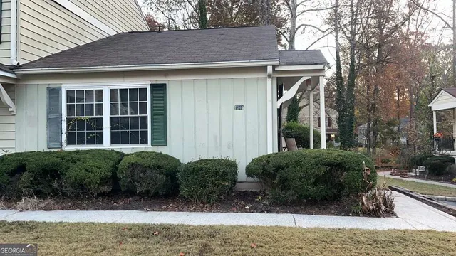a front view of a house with garden