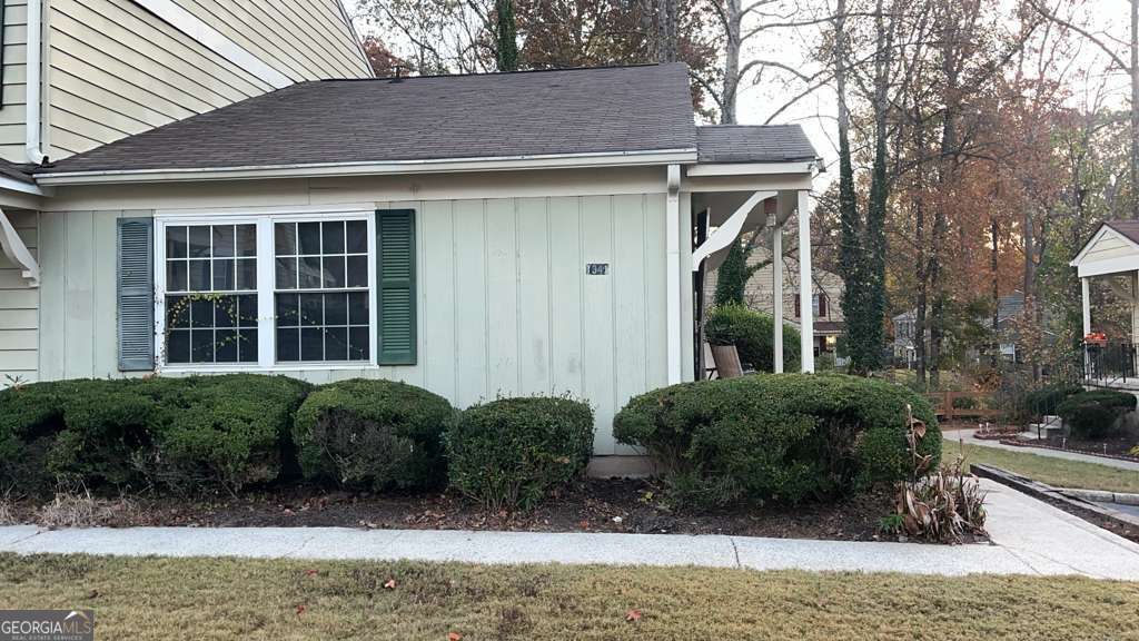 1341 Old Coach Road Southwest Marietta, GA 30008 - Photo 2 of 7 a front view of a house with garden