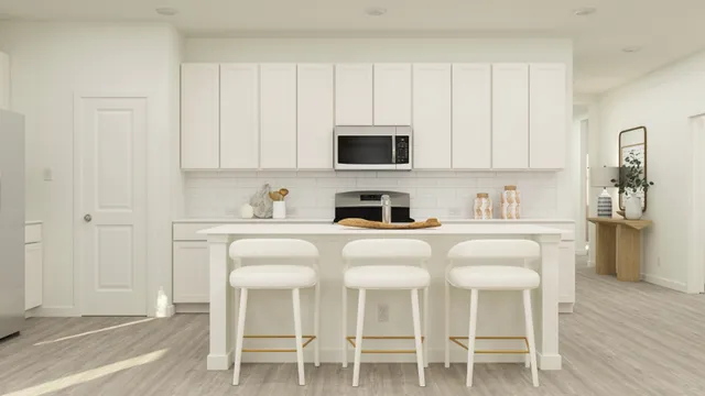 a kitchen with a sink and cabinets