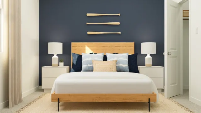 a bedroom with a bed and a potted plant