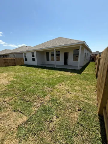 a view of a kitchen with a sink and cabinets