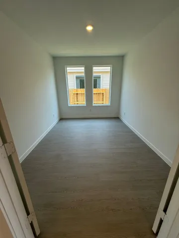 a view of a hallway with a room