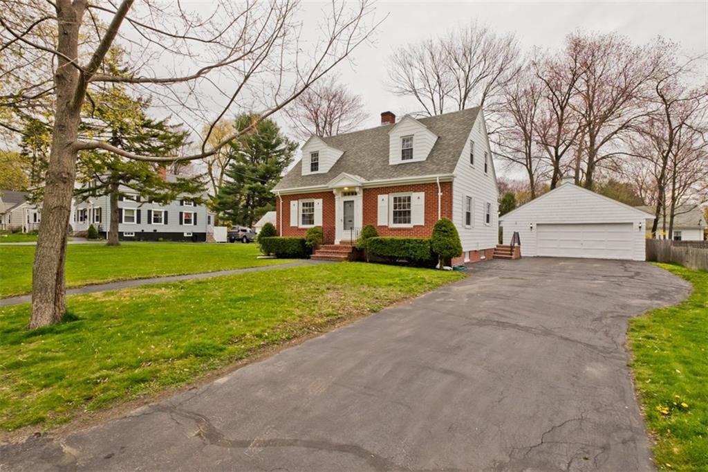 Exterior front, driveway, and 2 car...
